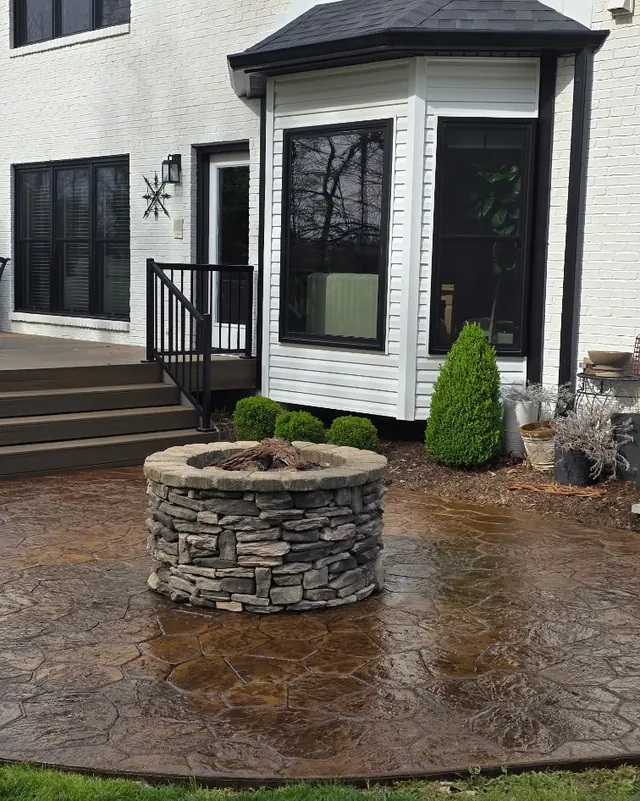 Stamped concrete patio with a stone fire pit after sealing