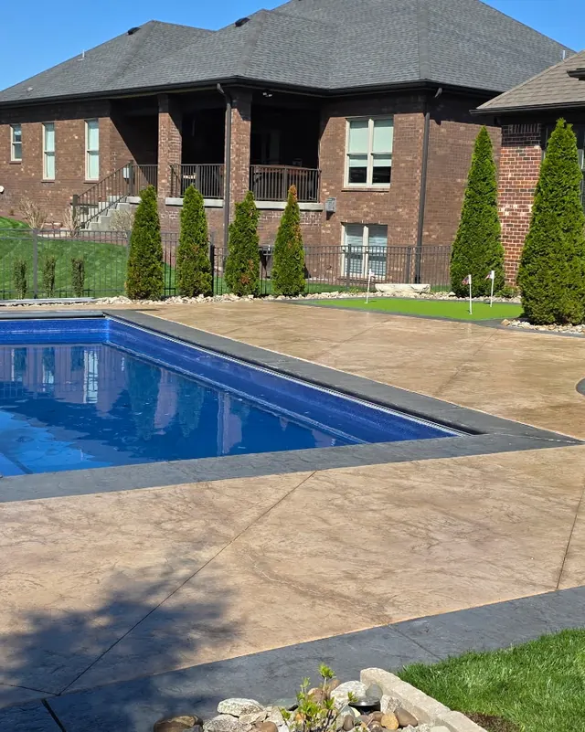 Stamped concrete pool deck after cleaning and sealing