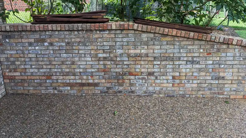 After: brick planter wall and aggregate patio, cleaned by Meyer Pressure Washing