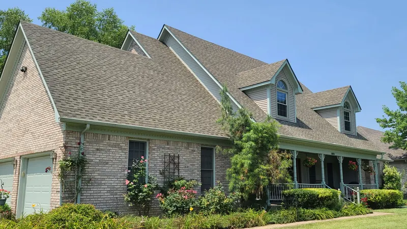 After: shingle roof on a brick home with dormers, cleaned by Meyer Pressure Washing