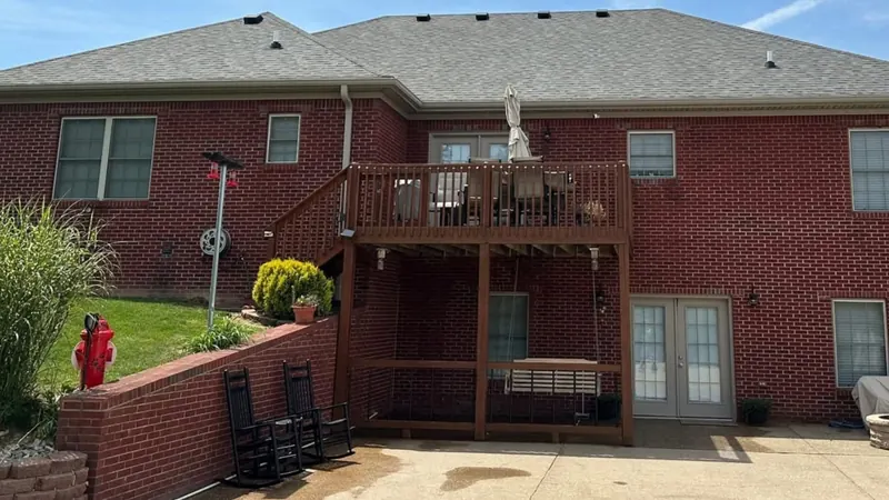 After: rear shingle roof of a brick home, cleaned by Meyer Pressure Washing
