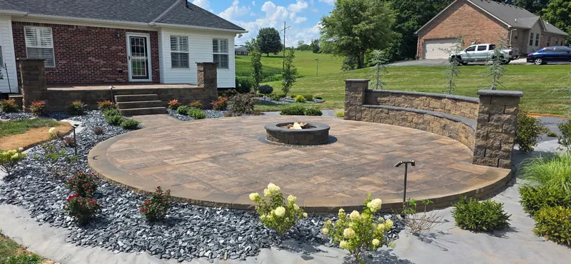 Round paver patio with a fire pit after cleaning and sealing