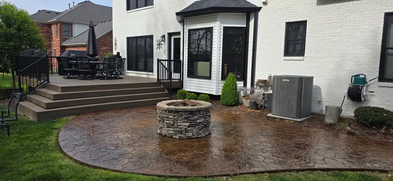 Stamped concrete patio with a stone fire pit after sealing