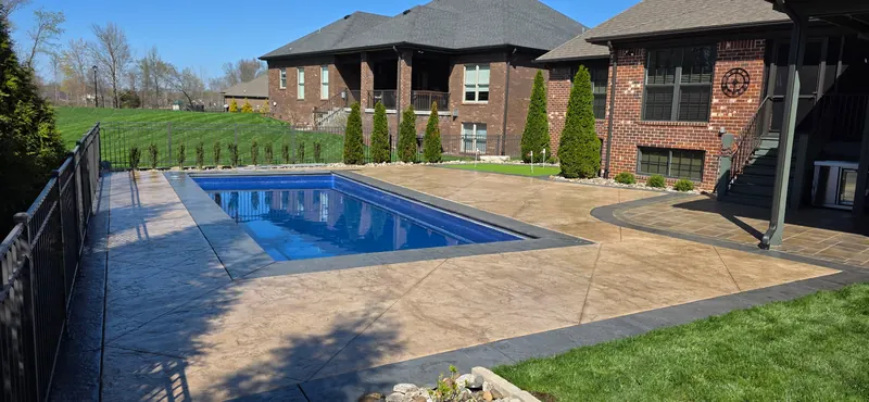 Stamped concrete pool deck after cleaning and sealing